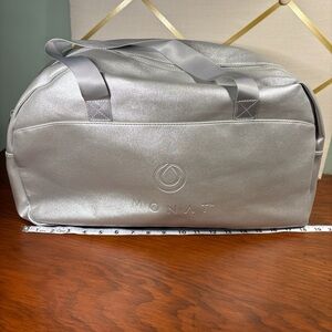 Monday Silver Metallic travel/gym Bag. NWOT